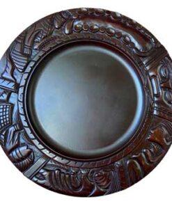 Divination tray of the Yoruba ethnic group, from Nigeria. As part of his consultations, the diviner throws cowries on the board, allowing him to read the future of the person consulted. The piece, decorated with very fine details, is carved in dense wood.